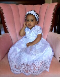 Young girl wearing formal dress by K's Couture